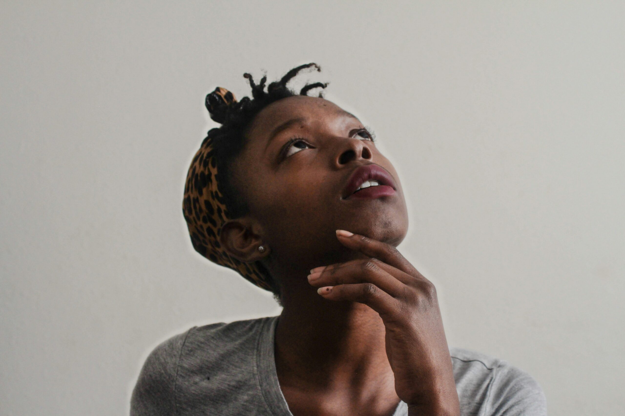 young black woman looking upwards