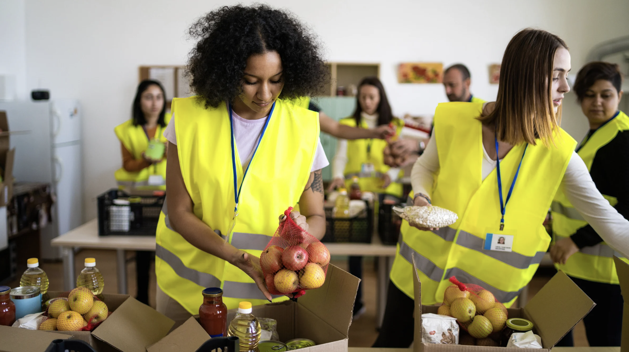 people packing food donations